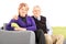 Lovely mature couple sitting on sofa