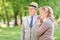 Lovely mature couple standing in park