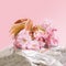 Lovely minimal spring concept. Arrangement made of cherry blossom spring flowers against a silver metallic pink background