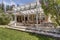 Lovely outdoor deck patio space with white dining pergola.