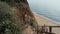 Lovely pair rest beach sunny day. Cheerful guy kissing charming girl on seashore