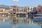 Lovely pastel houses and their reflections in the old port of Rethymno, Crete, Greece