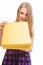 Lovely portrait of young happy teen opening yellow gift box