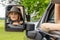 A Lovely Redhead Model Sits In Her Truck While Wearing A Cowboy Hat On Her Farm