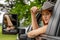 A Lovely Redhead Model Sits In Her Truck While Wearing A Cowboy Hat On Her Farm