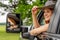 A Lovely Redhead Model Sits In Her Truck While Wearing A Cowboy Hat On Her Farm