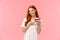 Lovely, romantic and alluring redhead girlfriend baked delicious surprise for valentines day date, holding peace cake on