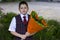 The lovely school student with a beautiful bouquet of flowers, a subject on September 1