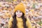 Lovely season. Keep warmest this autumn. Child in yellow hat outdoors. Autumn skin care routine. Kid wear warm knitted