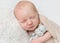 Lovely sleeping baby with soft toy, closeup