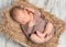 Lovely sleeping baby wrapped in basket with fluffy blanket