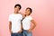 Lovely team. Teen couple posing on pink background