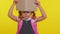 Lovely teenage girl kid in school uniform wears pink backpack peeping while hiding behind a book