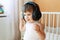 Lovely toddler listening to music with headphones