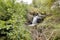 Lovely waterfall in typical Irish landscape