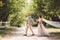 Lovely wedding couple wood forest. Bride and groom, follow me, married couple, woman in white wedding dress and veil. Rustic