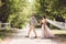 Lovely wedding couple wood forest. Bride and groom, follow me, married couple, woman in white wedding dress and veil. Rustic