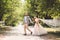 Lovely wedding couple wood forest. Bride and groom, follow me, married couple, woman in white wedding dress and veil. Rustic