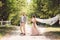 Lovely wedding couple wood forest. Bride and groom, follow me, married couple, woman in white wedding dress and veil. Rustic