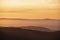 Lovely Winter landscape view from Red Screeds across misty layers of mountains towards the East