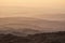 Lovely Winter landscape view from Red Screeds across misty layers of mountains towards the East