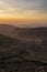 Lovely Winter landscape view from Red Screes across misty layers of mountains towards the East