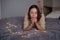 Lovely woman lying on bed with glowing lights