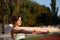 Lovely woman warms up before running