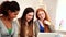 Lovely women using notebook sitting on couch