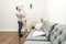 Lovely young couple in a living room with a modern interior face to face.