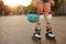 Lovely young girl enjoying rollerblading outdoors