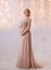 Lovely young pregnant woman in a beautiful dress