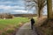 Lovenjoel: Man walking a soft road through the agriculture fields