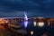 Lover`s Bridge at Fisherman`s Wharf lights up the mouth of the Tamsui River at night