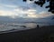 Lover walk on romantic long quiet beach under beautiful sky