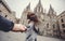 Lovers couple holding hands in a Cathedral Holy Cross and Saint Eulalia