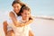 Lovers couple in love having fun on beach portrait