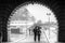 Lovers couple walking on the Sein quai in Paris during a rainy day