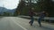 Lovers dancing around forest nature on mountains road. Couple hold hands outside