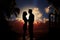 Lovers embrace, silhouetted against a sunset with palm trees