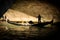 Lovers in Gondola under a Bridge in Venice