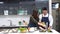 Lovers in kitchen, Friend or couple are cooking in the modern kitchen. Couples washing vegetables.
