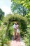 Lovers newlyweds. Beautiful couple in love. Loving couple in the garden among the flowers. Just married. Beautiful bride and groom