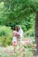 Lovers newlyweds. Beautiful couple in love. Loving couple in the garden among the flowers. Just married. Beautiful bride and groom