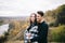 Lovers walking in the mountains. Autumn love of two happy people. Lovebirds are embracing. Soft focus.