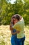 Lovers. A young couple. The guy with the girl are walking in the forest. Loving couple hugs sensually. Lovers man and woman in the