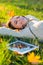 She loves her tunes. An attractive young woman listening to music on her digital tablet while outdoors.