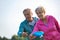 Loving active couple throwing flying disc together in park