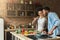 Loving african-american couple preparing dinner in loft kitchen