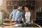 Loving african-american couple preparing meal in loft kitchen